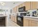 Well-equipped kitchen with ample counter space at 14203 W Rico Dr, Sun City West, AZ 85375