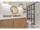 Elegant bathroom with a stylish vanity and a glass shower at 1422 W Colter St, Phoenix, AZ 85013