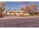 Mid-century modern home with updated garage and landscaping at 1422 W Colter St, Phoenix, AZ 85013