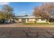 Mid-century modern home with updated garage and landscaping at 1422 W Colter St, Phoenix, AZ 85013