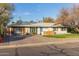 Mid-century modern home with updated garage and landscaping at 1422 W Colter St, Phoenix, AZ 85013