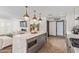 Sleek kitchen island with marble countertop and built-in microwave at 1422 W Colter St, Phoenix, AZ 85013