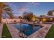 Inviting backyard pool with spacious patio and lounge chairs at 1422 W Colter St, Phoenix, AZ 85013