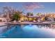 Inviting pool with lounge chairs, surrounded by a beautifully landscaped backyard at 1422 W Colter St, Phoenix, AZ 85013