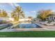 Beautiful rectangular pool with stone patio and lounge chairs at 1422 W Colter St, Phoenix, AZ 85013