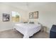 Cozy bedroom with a queen-size bed and a side table at 155 N Lakeview Blvd # 100, Chandler, AZ 85225