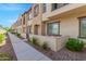 Modern townhome exterior with walkway and landscaping at 155 N Lakeview Blvd # 100, Chandler, AZ 85225