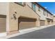 View of building exterior showing multiple garages at 155 N Lakeview Blvd # 100, Chandler, AZ 85225