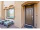 Townhome entrance with modern door and patio seating at 155 N Lakeview Blvd # 100, Chandler, AZ 85225