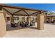 Covered seating area with patio furniture near pool at 155 N Lakeview Blvd # 100, Chandler, AZ 85225