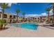 Community pool with lounge chairs and palm trees at 155 N Lakeview Blvd # 100, Chandler, AZ 85225