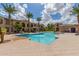 Inviting community pool with lounge chairs and palm trees at 155 N Lakeview Blvd # 100, Chandler, AZ 85225