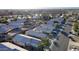 An aerial view of a quiet residential street lined with houses at 15725 W Post Dr, Surprise, AZ 85374