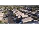 Aerial view of houses in a residential area with street and cars at 15725 W Post Dr, Surprise, AZ 85374