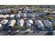 Aerial image showcasing a suburban neighborhood with homes and palm trees at 15725 W Post Dr, Surprise, AZ 85374