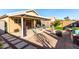 Inviting backyard with covered patio, fire pit, and ample seating at 15725 W Post Dr, Surprise, AZ 85374