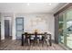 Dining area with a rustic wood table and metal chairs at 15725 W Post Dr, Surprise, AZ 85374