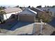 Single-story home with attached garage and landscaped front yard at 15725 W Post Dr, Surprise, AZ 85374