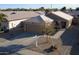 Single-story home with attached garage and landscaped front yard at 15725 W Post Dr, Surprise, AZ 85374