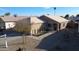 Single-story home with attached garage and landscaped front yard at 15725 W Post Dr, Surprise, AZ 85374