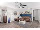 Living room featuring a brown sectional sofa and geometric rug at 15725 W Post Dr, Surprise, AZ 85374