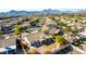 Aerial view of a house with a backyard, landscaping, and mountain views in the background at 16146 E Gleneagle Dr, Fountain Hills, AZ 85268