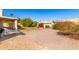 Backyard with patio, lawn, and desert landscaping at 16146 E Gleneagle Dr, Fountain Hills, AZ 85268