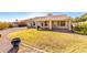 Backyard view of home with covered patio and lawn at 16146 E Gleneagle Dr, Fountain Hills, AZ 85268