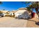 House exterior featuring a two-car garage and desert landscaping at 16146 E Gleneagle Dr, Fountain Hills, AZ 85268