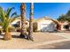 House exterior with a two-car garage and palm trees at 16146 E Gleneagle Dr, Fountain Hills, AZ 85268