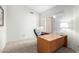 Home office with wood desk, green chair, and window with shutters at 16146 E Gleneagle Dr, Fountain Hills, AZ 85268