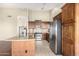 Kitchen with granite countertops and dark wood cabinets at 16146 E Gleneagle Dr, Fountain Hills, AZ 85268