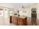 Kitchen island with granite countertops, and hardwood floors at 16146 E Gleneagle Dr, Fountain Hills, AZ 85268