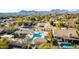 Aerial view of community pool, playground, and surrounding homes at 16146 E Gleneagle Dr, Fountain Hills, AZ 85268