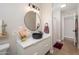 Bathroom with round mirror, vessel sink, and modern vanity at 1624 W Lawrence Rd, Phoenix, AZ 85015