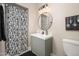 Clean bathroom with a cactus-themed shower curtain and updated vanity at 1624 W Lawrence Rd, Phoenix, AZ 85015