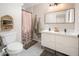 Modern bathroom with double vanity, shower, and stylish fixtures at 1624 W Lawrence Rd, Phoenix, AZ 85015