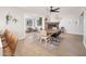 Bright dining room with a wooden table and chairs near a fireplace at 1624 W Lawrence Rd, Phoenix, AZ 85015