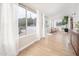 Living room with hardwood floors and sliding glass doors leading to the backyard at 1624 W Lawrence Rd, Phoenix, AZ 85015