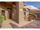 Front entry with tile flooring, decorative door, and patio seating at 16813 S 37Th Way, Phoenix, AZ 85048