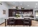 Modern kitchen featuring granite countertops and dark wood cabinetry at 16813 S 37Th Way, Phoenix, AZ 85048