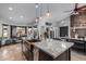 Bright kitchen with copper farm sink, granite counters, and views to backyard at 16813 S 37Th Way, Phoenix, AZ 85048