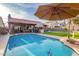 Sparkling pool with patio and umbrella for shade at 16813 S 37Th Way, Phoenix, AZ 85048