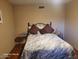 Cozy bedroom with a comfortable bed and two side tables at 1707 E Mclellan Blvd, Phoenix, AZ 85016