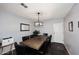 Spacious dining room with a large wooden table and black leather chairs at 1707 E Mclellan Blvd, Phoenix, AZ 85016