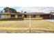 House exterior featuring a landscaped lawn and attached garage at 1707 E Mclellan Blvd, Phoenix, AZ 85016