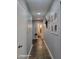 Bright hallway with tile flooring and framed Gathering photos at 1707 E Mclellan Blvd, Phoenix, AZ 85016