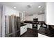 Modern kitchen with white cabinets, granite counters, and stainless appliances at 1707 E Mclellan Blvd, Phoenix, AZ 85016