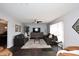 Spacious living room with dark leather sofas and a large TV at 1707 E Mclellan Blvd, Phoenix, AZ 85016