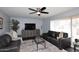 Living area featuring dark leather sofas and tile floors at 1707 E Mclellan Blvd, Phoenix, AZ 85016